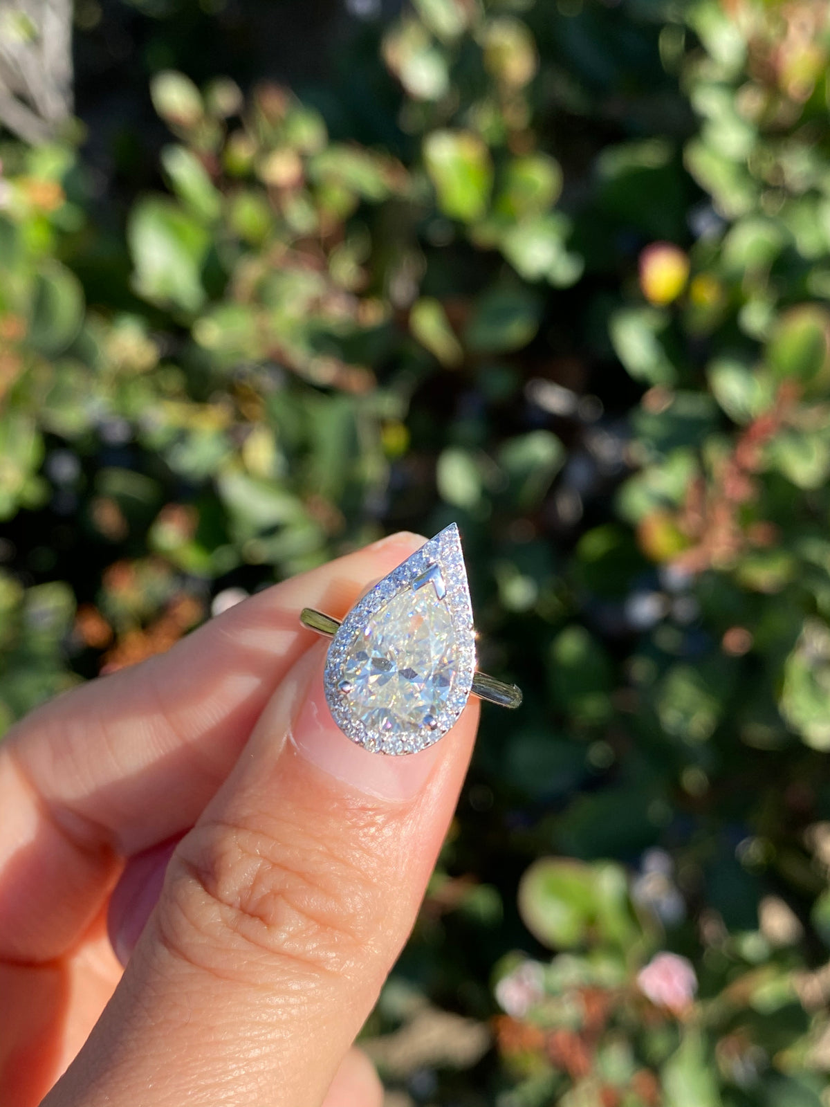 9x6mm (1.30ct) Ava ForeverOne Pear Moissanite Solitaire Diamond Halo Engagement Ring 14K MOENG051