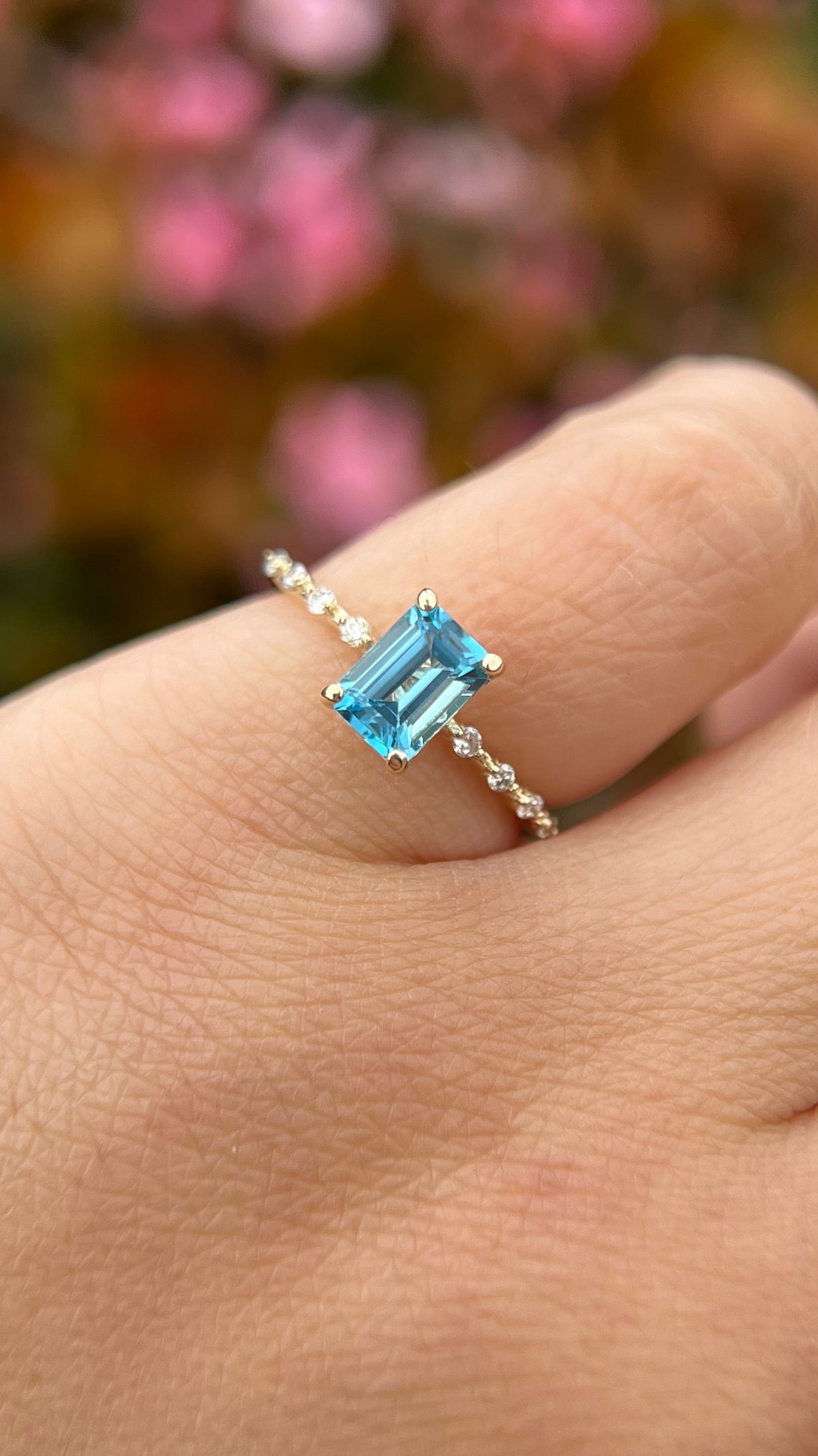 Bella 7x5mm 0.70ct Emerald Cut Blue Topaz Spaced Diamond Ring 14K Gold DFR035